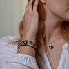 Lade das Bild in den Galerie-Viewer, Positive Aura Schwarzer Onyx Vergoldete Perlen Armband